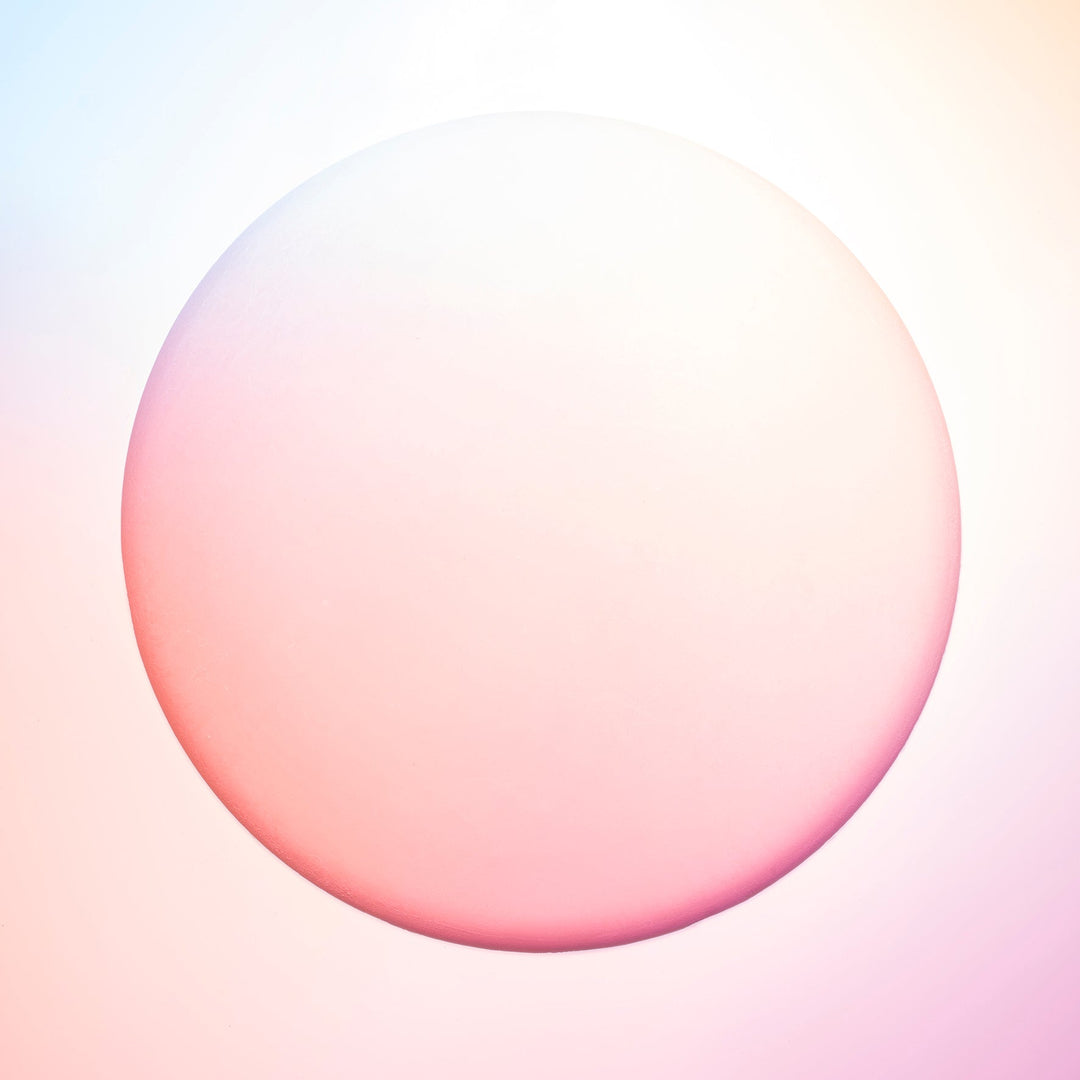 This image captures a lovely peach hue projected onto a round, plaster surface. We find this image evokes a peaceful warmth.
