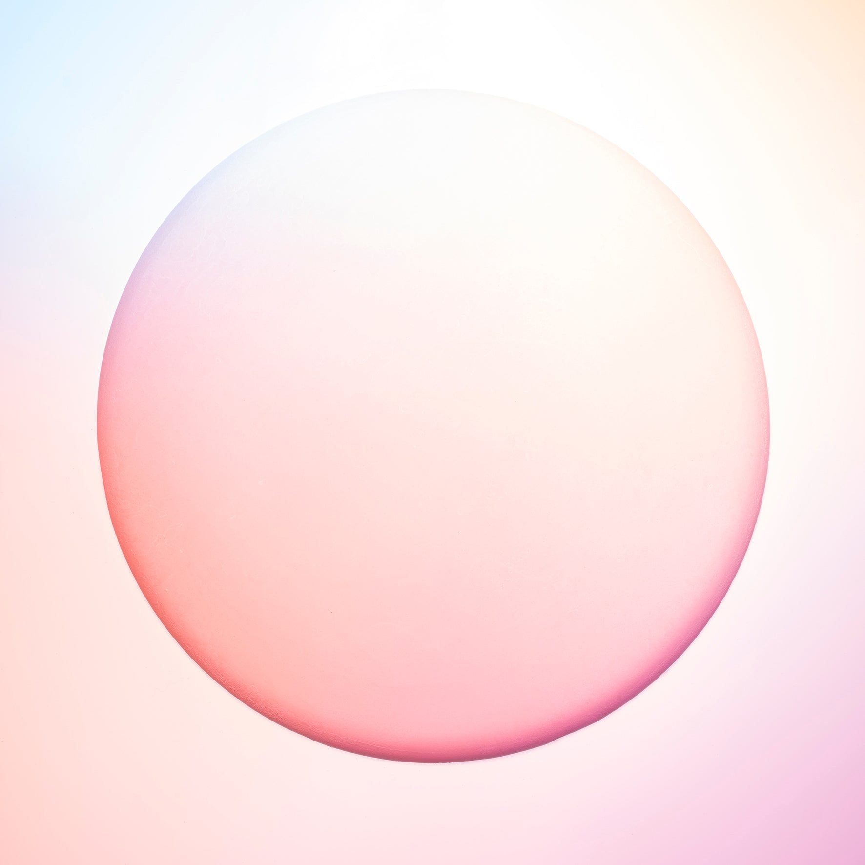 This image captures a lovely peach hue projected onto a round, plaster surface. We find this image evokes a peaceful warmth.