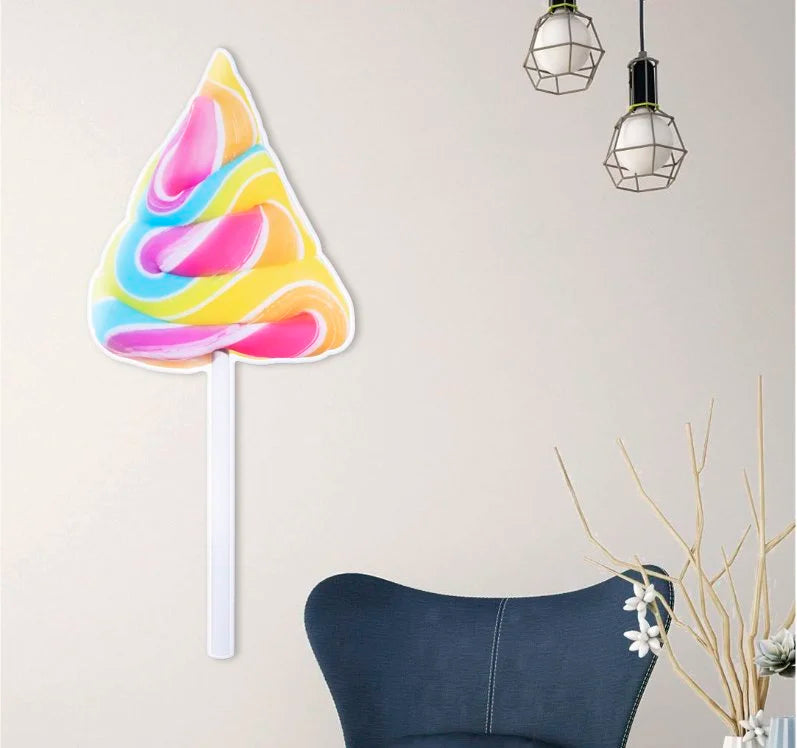 bright pink, blue and yellow lollipop - photographic sculpture wall art by Rory Fink – limited edition shaped print in room example